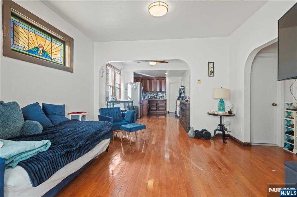 436 Undercliff Avenue, Unit 1 Edgewater, NJ 07020 - Photo 10 of 16 a living room with furniture and a wooden floor