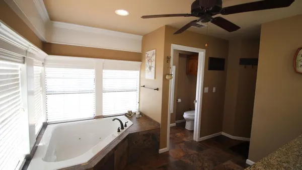 a bathroom with a tub and a sink