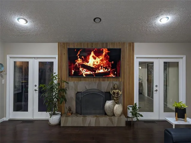 a view of a room with furniture and wooden floor