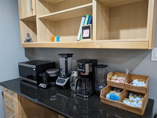 a bedroom with a bed and a television