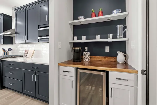 a kitchen with cabinets and appliances