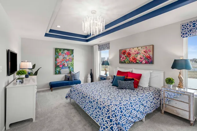 a bedroom with a bed and ceiling fan