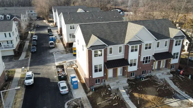 an aerial view of a house with a yard