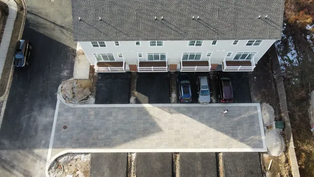 a living room with stainless steel appliances kitchen island granite countertop a stove and a sink