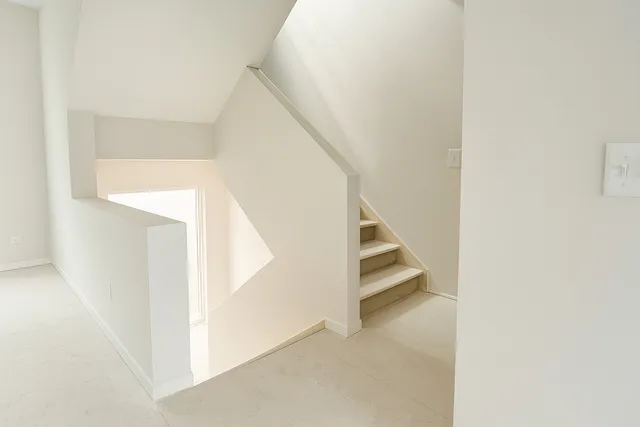 a view of staircase with white walls and white walls