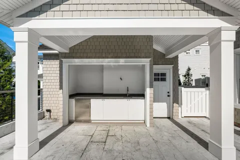 a bedroom with a large bed and a balcony