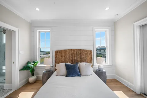 a bedroom with a large bed and a window