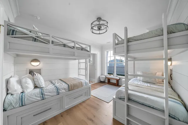 a bedroom with a large bed and a window