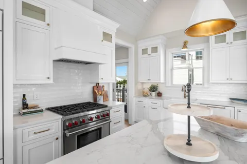 a living room with furniture a rug and a large window