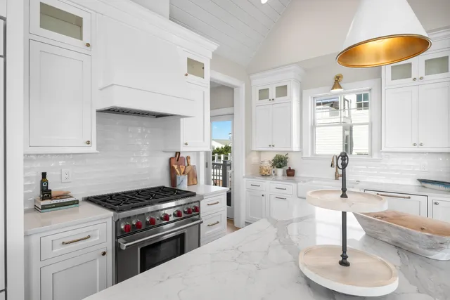 a living room with furniture a rug and a large window