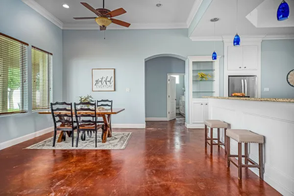 a view of a dining room with furniture a chandelier