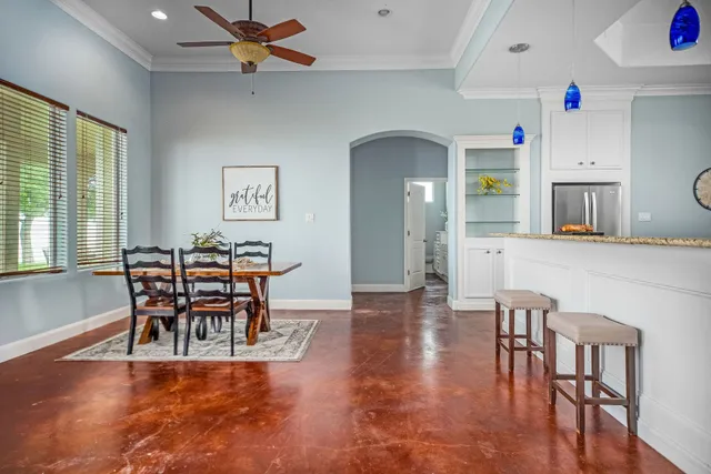 a view of a dining room with furniture a chandelier
