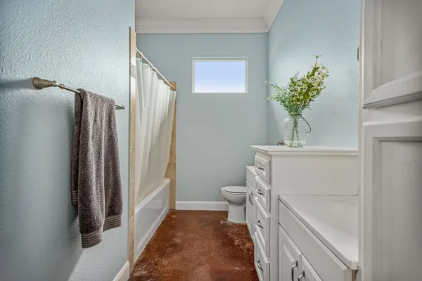 a bedroom with bed and window