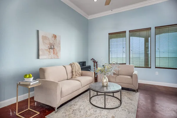 a dining room with furniture and wooden floor