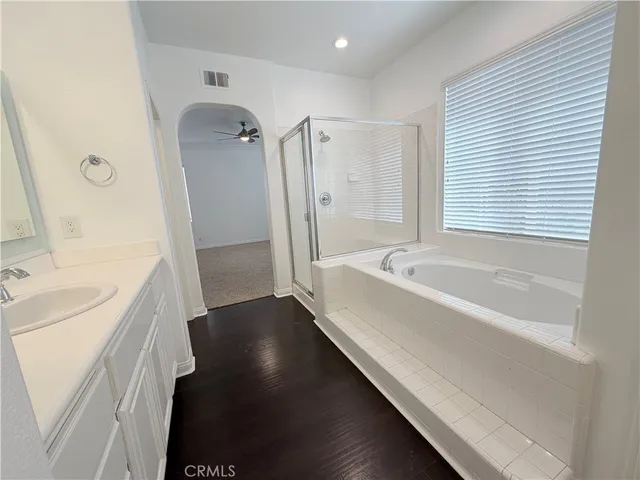 a bathroom with a bathtub and a sink