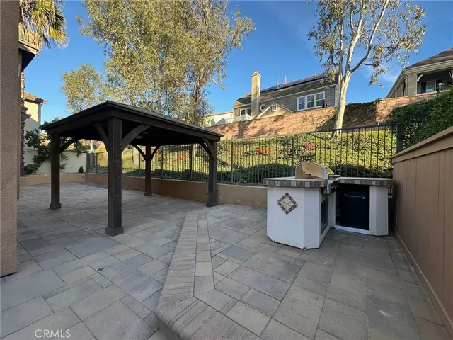 a front view of a house with sitting area