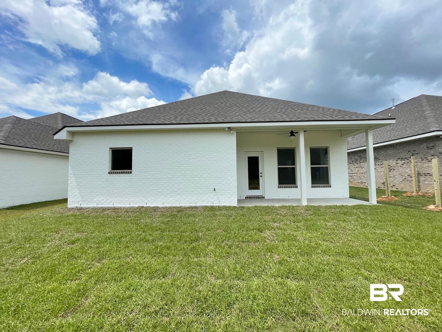 1412 Fenton Circle Foley, AL 36535 - Photo 13 of 15 Back of property featuring a patio area, a yard, and ceiling fan