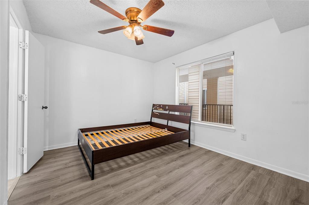 3921 Southwest 34th Street, Unit 208 Gainesville, FL 32608 - Photo 15 of 33 wooden floor with a window in a room