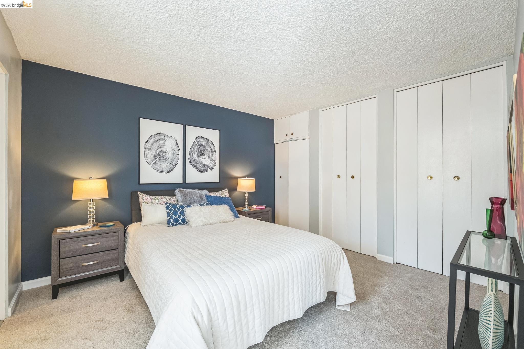 2550 Dana Street, Unit 2F Berkeley, CA 94704 - Photo 12 of 32 a bedroom with a bed and a lamp