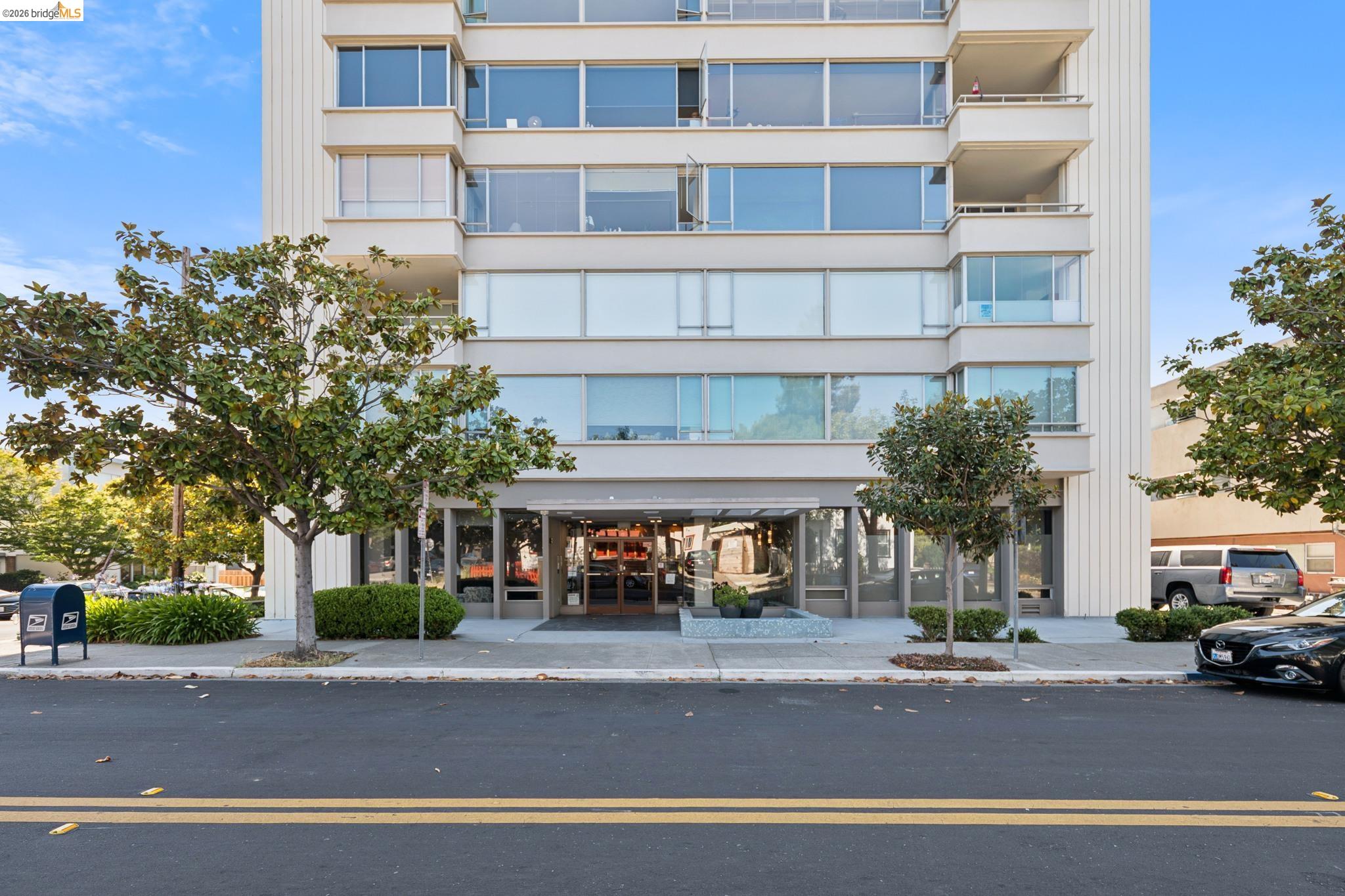 2550 Dana Street, Unit 2F Berkeley, CA 94704 - Photo 17 of 32 a view of a building and a people on a street