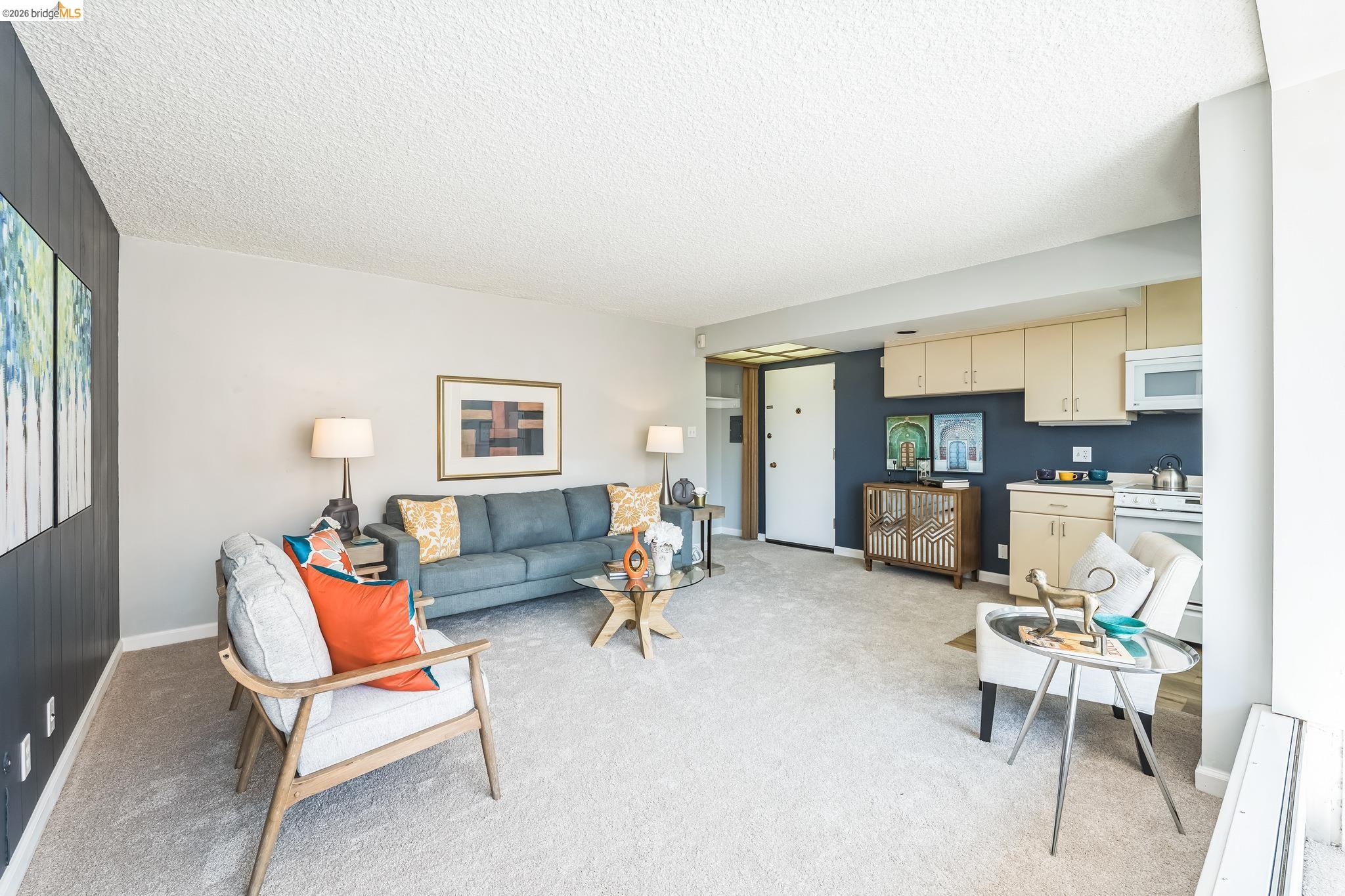 2550 Dana Street, Unit 2F Berkeley, CA 94704 - Photo 2 of 32 a living room with furniture and kitchen view