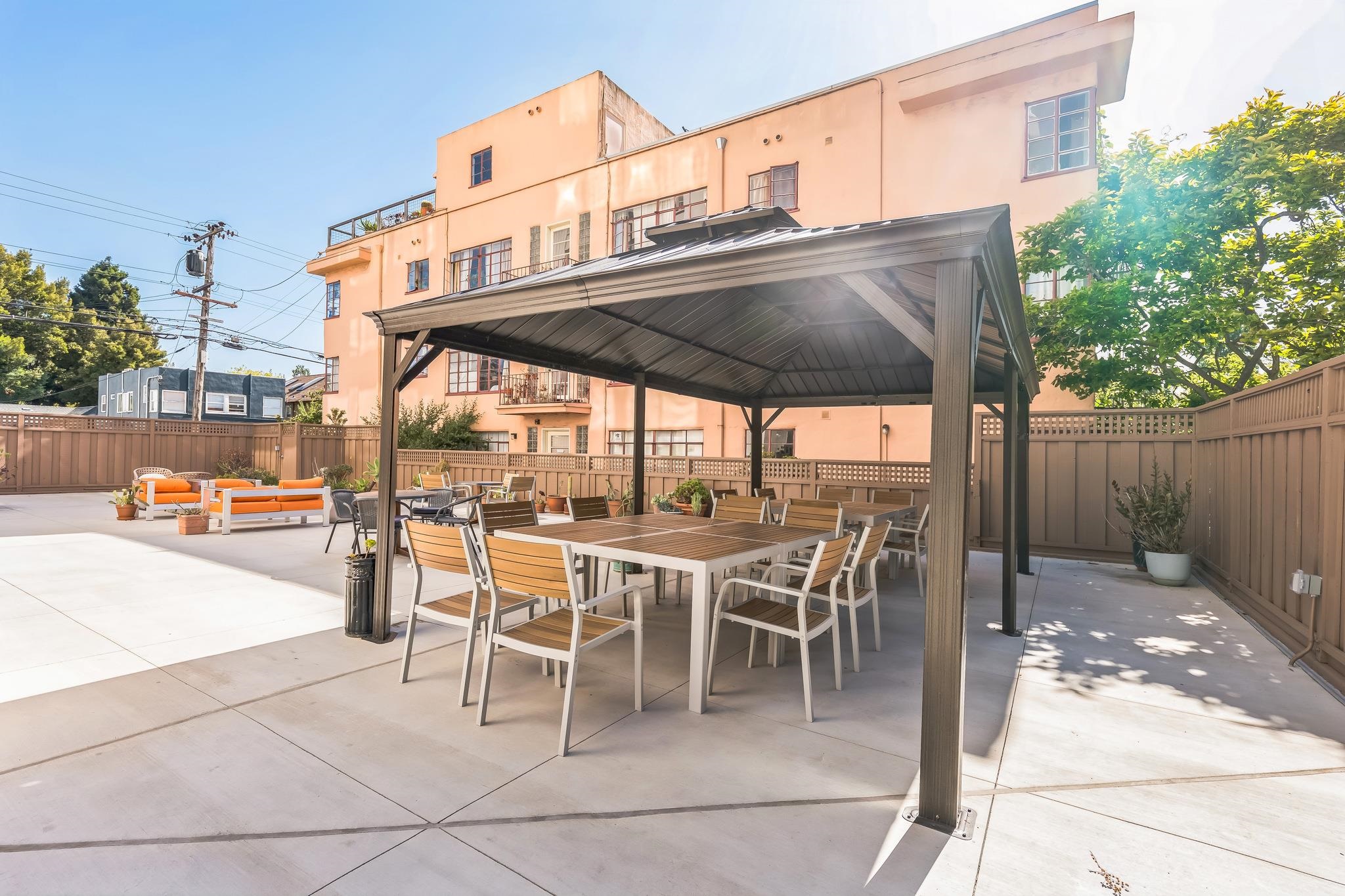 2550 Dana Street, Unit 2F Berkeley, CA 94704 - Photo 21 of 32 a patio with a table and chairs