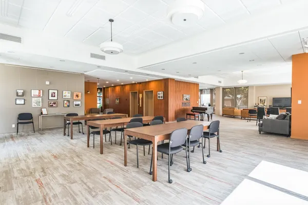 a room with furniture and wooden floor