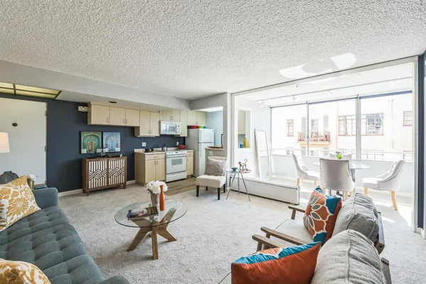 a living room with furniture and a large window