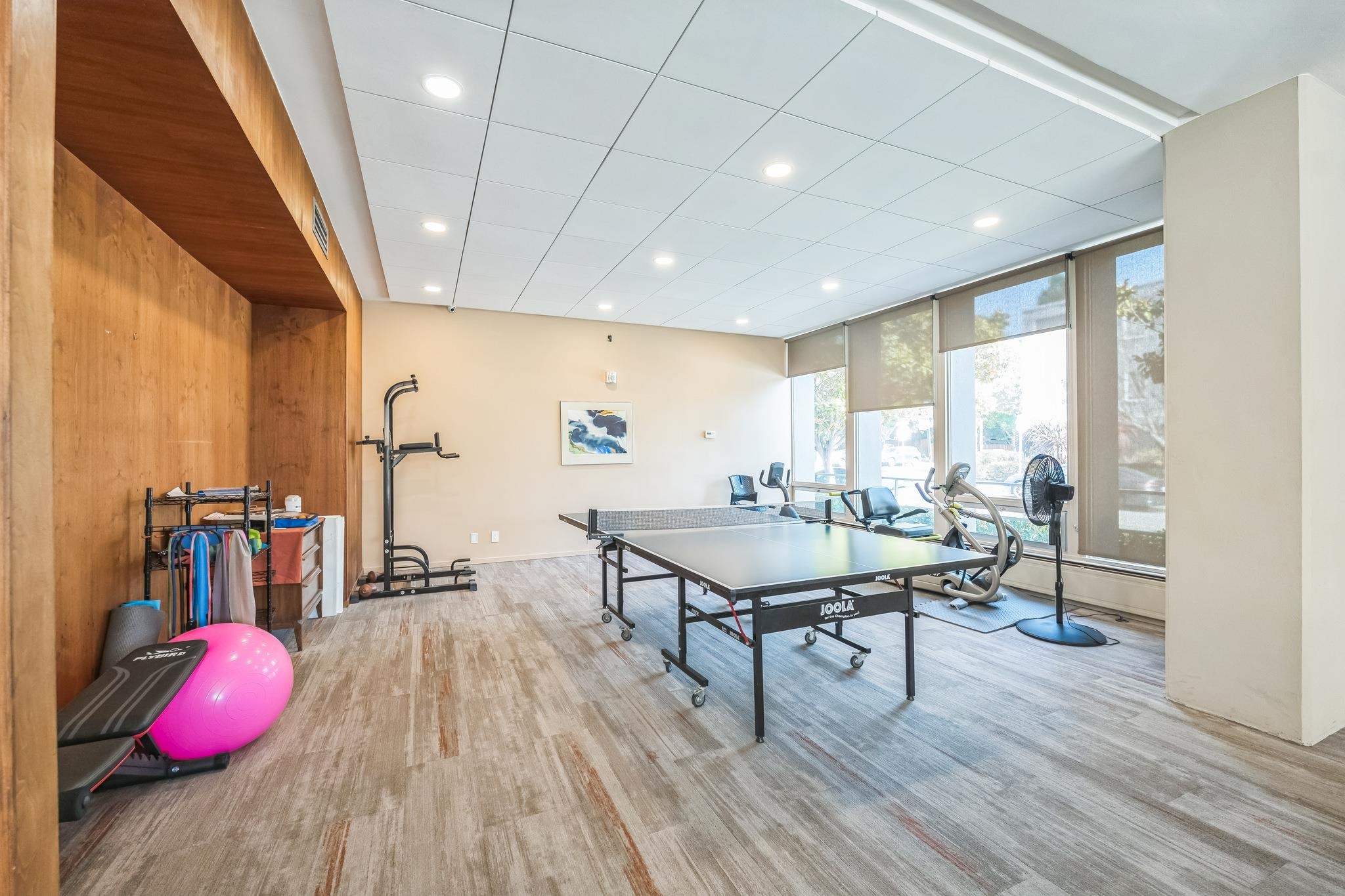 2550 Dana Street, Unit 2F Berkeley, CA 94704 - Photo 31 of 32 a room with furniture and wooden floor