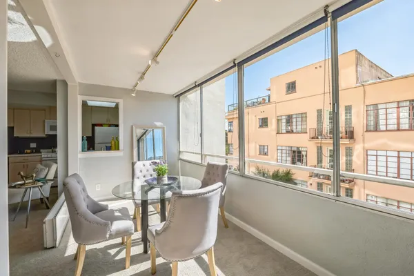 a dining room with furniture and window