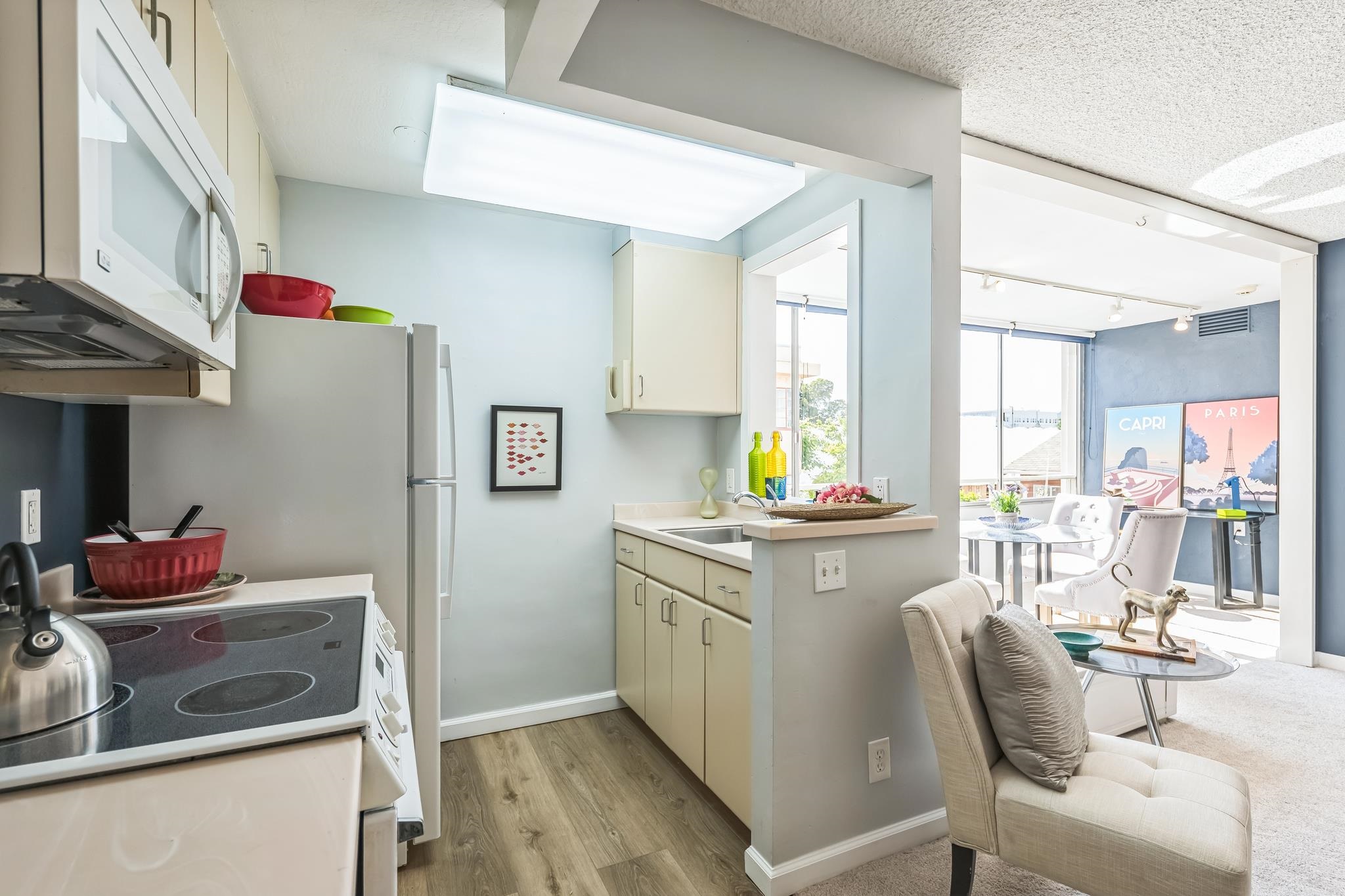 2550 Dana Street, Unit 2F Berkeley, CA 94704 - Photo 10 of 32 a kitchen with stainless steel appliances granite countertop a stove and a refrigerator