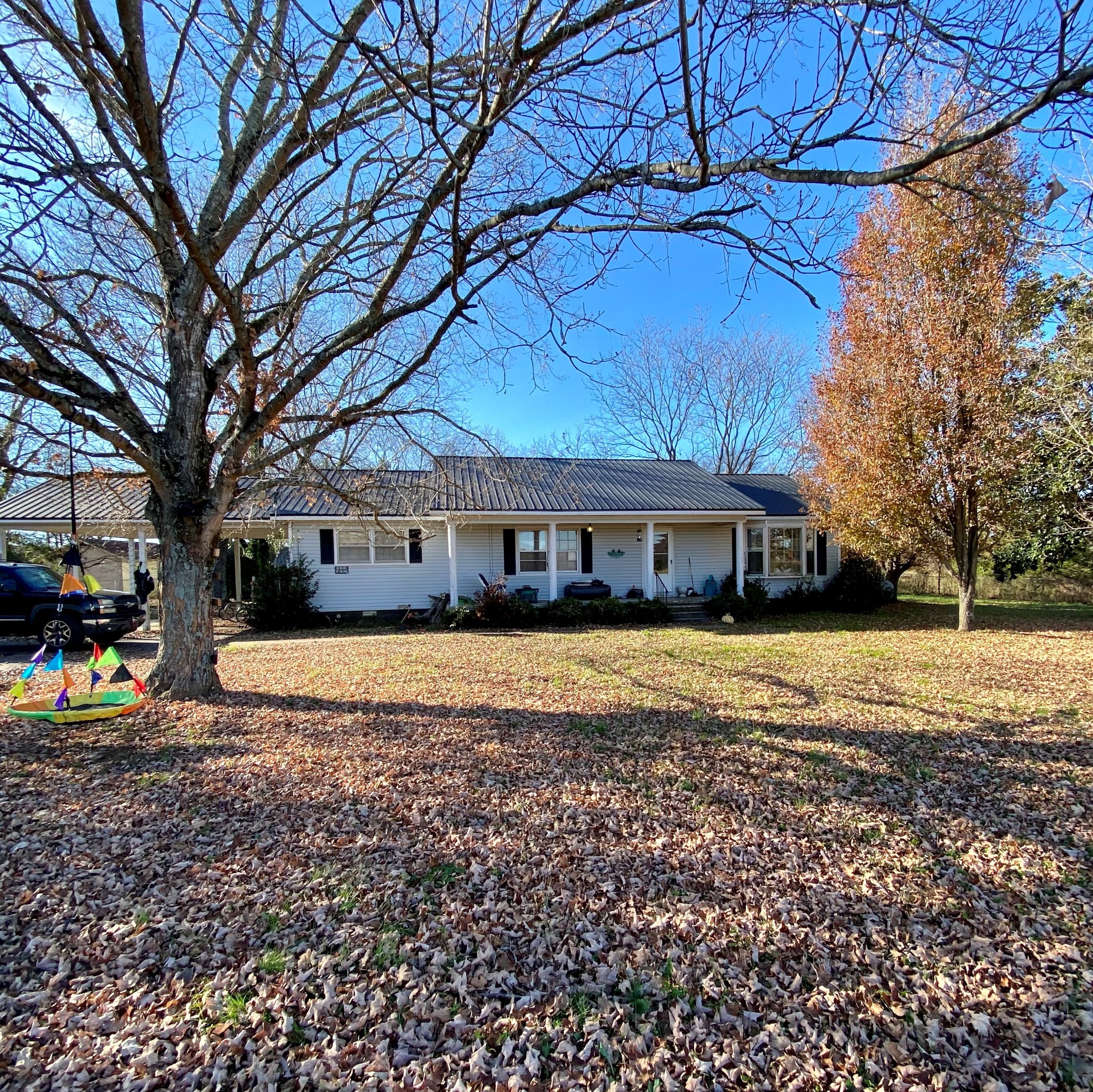 1071 Baugh Road Ardmore, TN 38449 - Photo 2 of 16 a front view of a house with a yard and swimming pool