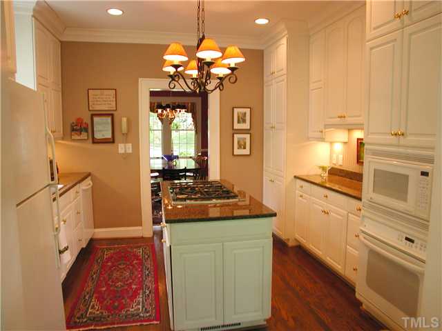 2234 The Circle Raleigh, NC 27608 - Photo 4 of 12 a kitchen with a stove oven and a refrigerator