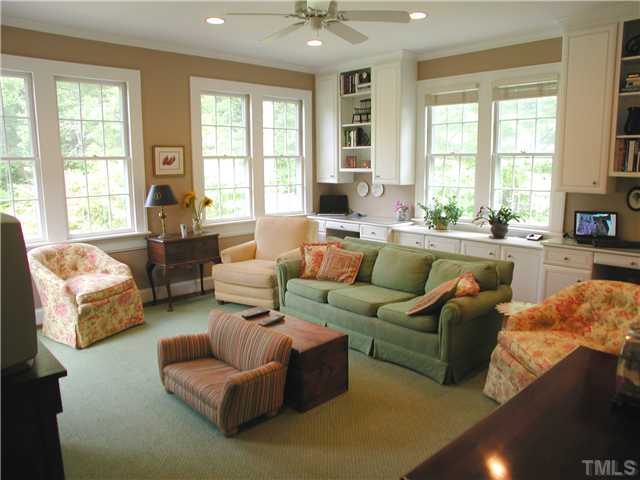2234 The Circle Raleigh, NC 27608 - Photo 5 of 12 a living room with furniture and large windows