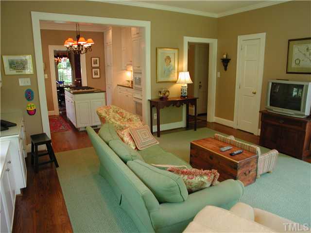 2234 The Circle Raleigh, NC 27608 - Photo 6 of 12 a living room with furniture and a flat screen tv