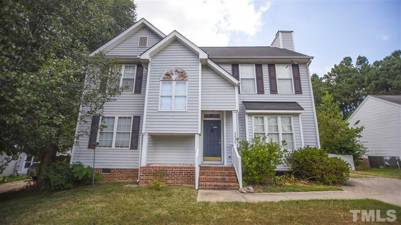 2829 Pinehurst Drive Raleigh, NC 27604 - Photo 1 of 16 a view of a house with brick walls and flower plants