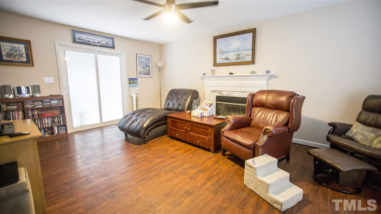 2829 Pinehurst Drive Raleigh, NC 27604 - Photo 5 of 16 a living room with furniture rug and wooden floor
