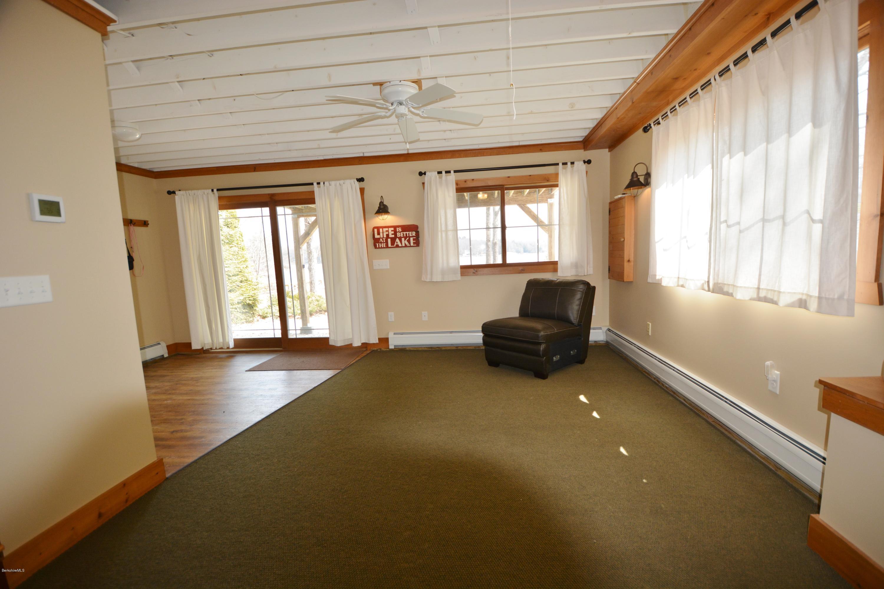 16 Old Stagecoach Road Otis, MA 01029 - Photo 14 of 24 a living room with furniture and a large window