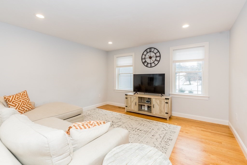 40 Allen Road Billerica, MA 01821 - Photo 10 of 32 a bedroom with a bed and a flat screen tv