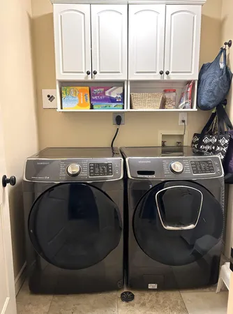 a utility room with dryer and washer