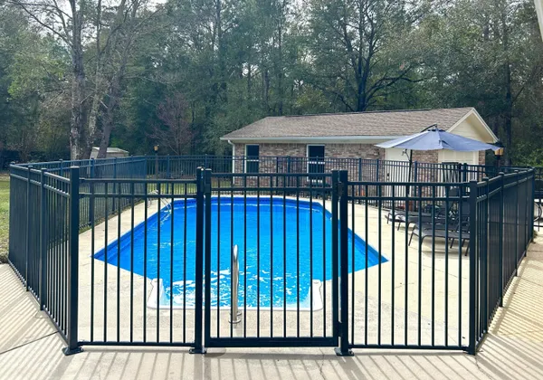 a view of a small yard and deck