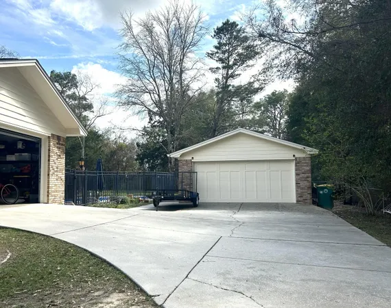 a view of house and yard with green space
