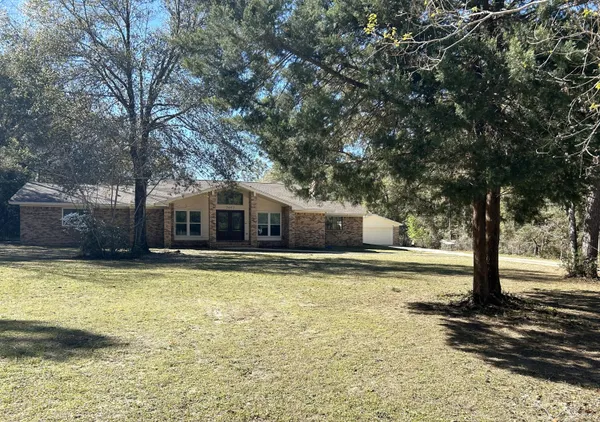a view of a swimming pool with an outdoor space and seating area