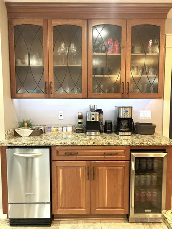 a kitchen with granite countertop a stove and cabinets