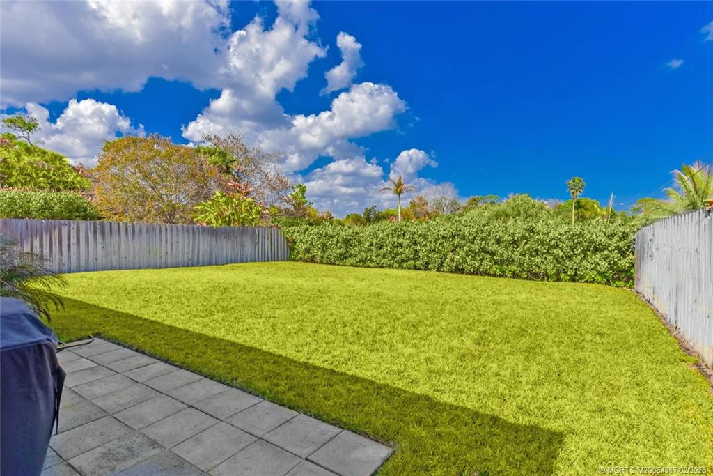 1091 Southwest 30th Street Palm City, FL 34990 - Photo 27 of 45 Lawn digitally enhanced following our rare freeze