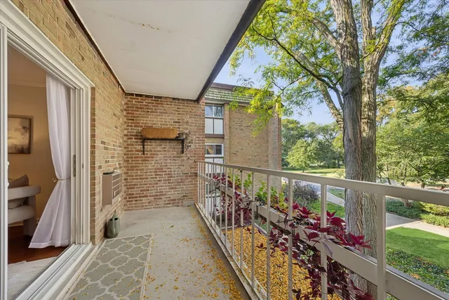 a view of balcony with wooden floor