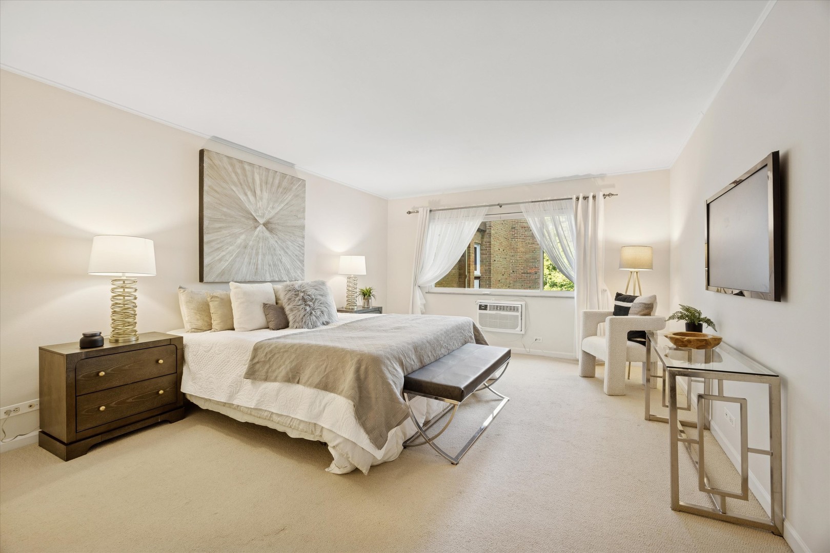 320 Claymoor, Unit 2D Hinsdale, IL 60521 - Photo 8 of 16 a spacious bedroom with a bed a couch and dresser