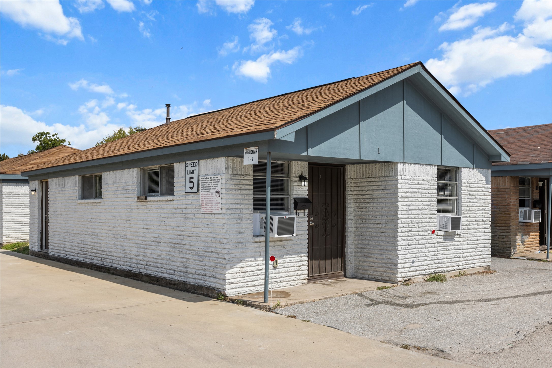 5718 Pickfair Street, Unit 4 Houston, TX 77026 - Photo 12 of 13 a front view of a house with a garage