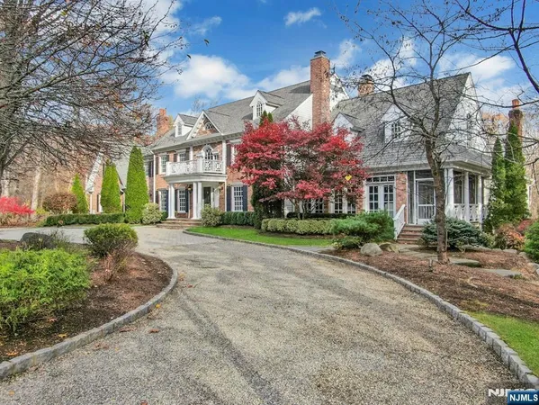 a front view of a building with a garden