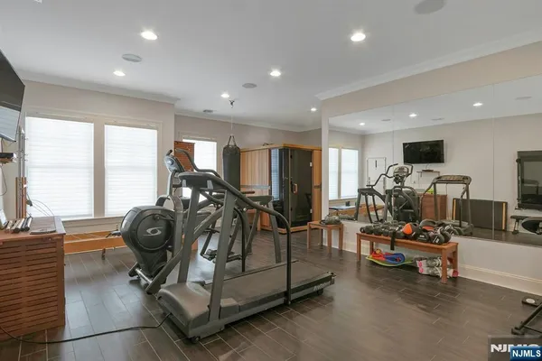 a view of a room with gym equipment and a large window